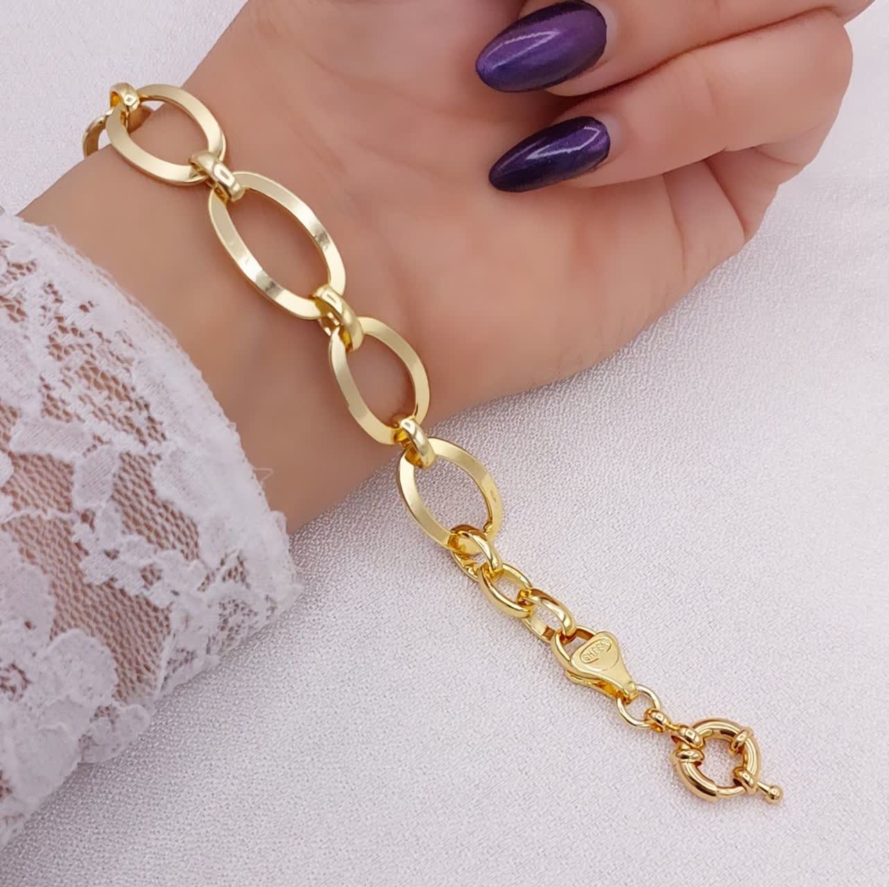 دستبند حلقهای زنانه طرح طلا حلقههای بیضی ساده با سطح براق