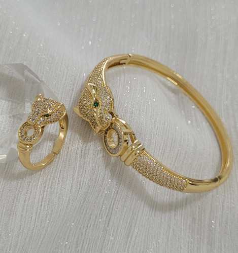 ست دستبند و انگشتر زنانه مدل پنتر برند NYH با طراحی پلنگی نگیندار و آبکاری طلایی براق