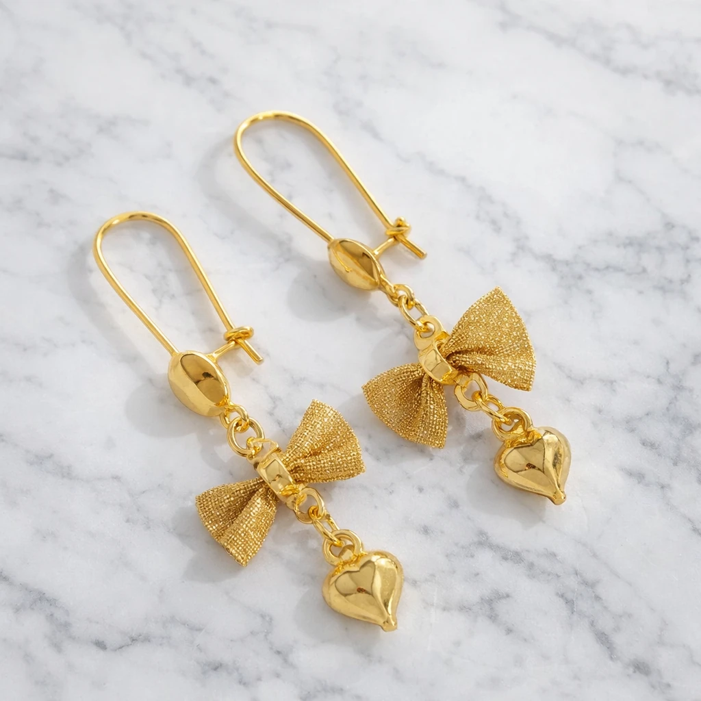 گوشواره آویز زنانه طلا روس طرح پاپیون و آویز قلب