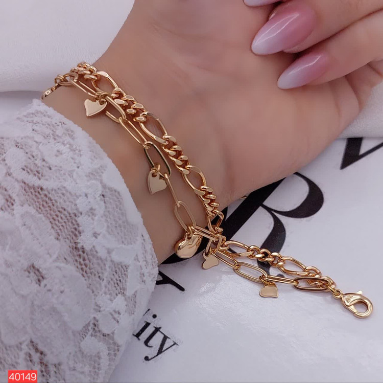 1. دستبند ژوپینگ اصل زنانه مدل دولایه قلب با آبکاری طلای لوکس کد 40149 2. خرید دستبند مارک ژوپینگ رنگ ثابت طرح دو قلب مدل 40149 از بدلیجات رستا 3. دستبند ظریف دخترانه ژوپینگ مدل قلب دولایه ضد حساسیت با درخشش خیرهکننده